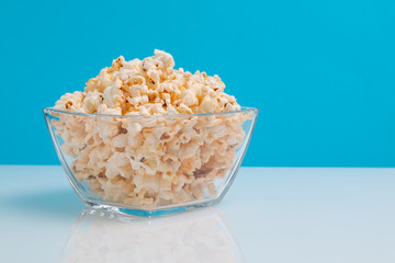 popcorn in a glass bowl with copy space