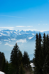 Majestic unique misty blue alpine skyline aerial view panorama of iced Swiss Alps and blue sky. Mount Rigi Switzerland.