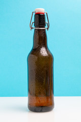 bottle with beer on a blue background