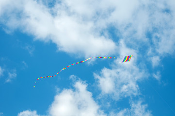 Colorful kites flying in blue sky