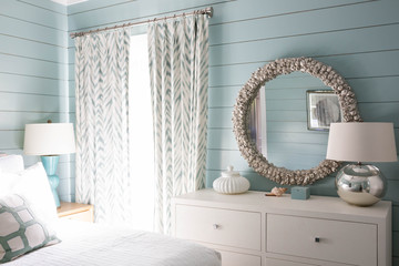 Modern beach house bedroom with teal walls - obrazy, fototapety, plakaty