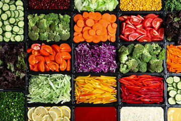 Salad bar with different fresh ingredients as background, top view