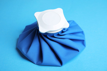 Ice pack on blue background. Cold compress