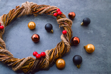 Christmas balls for the Christmas tree and a homemade Christmas wreath of twigs with holly berries...
