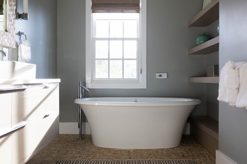 Fototapeta na wymiar Modern bathtub in master bathroom