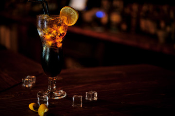 Coctail stays on a wood desk bar