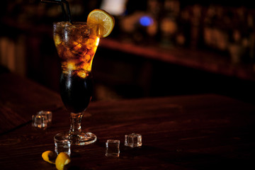 Coctail stays on a wood desk bar