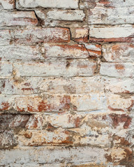 Background of old vintage dirty brick wall with peeling plaster, texture