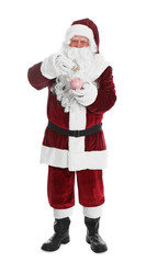 Santa Claus putting dollar banknote into piggy bank on white background