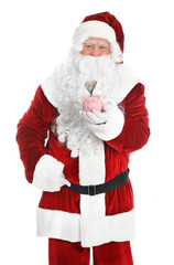 Santa Claus holding piggy bank with dollar banknotes on white background