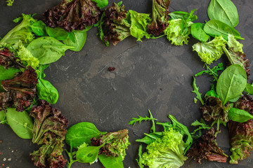 Healthy salad, leaves mix salad (mix micro greens, cucumber, tomato, onion, other ingredients). food background. copy space