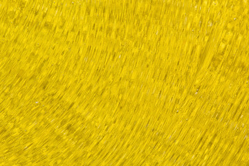 Golden background. Cosmetic gel texture