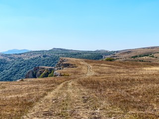 Mountain pasture in autumn sunny day.