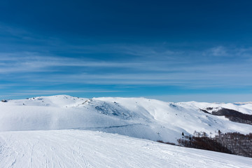 Fototapeta na wymiar Snowy slopes in 3-5 Pigadia ski center, Naoussa, Greece