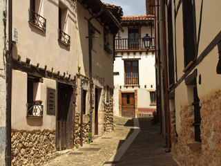 A street of Covarrubias with sun and shade