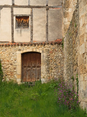 Fototapeta na wymiar Facade with a door and an old window.