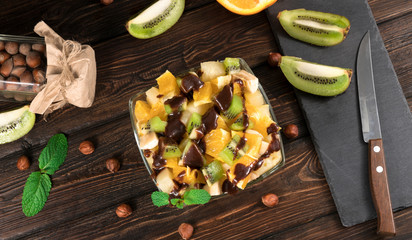 .fruit salad on a wooden background