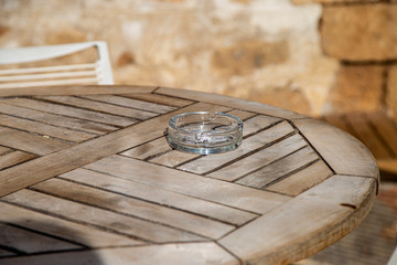 glass ashtray on a wooden table
