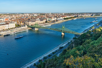 Fototapeta na wymiar Budapest, Hungary - October 01, 2019: View of the Liberty bridge and the river Danube with Gellért Hill (Hungarian: Gellért-hegy).
