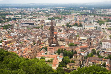 Fototapeta na wymiar View of the city of Freiburg, Germany with the Freiburg Cathedral seen from the Schlossberg mountain