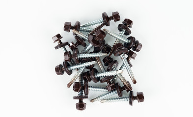 Self-tapping screws for fixing the roof with brown hex heads.