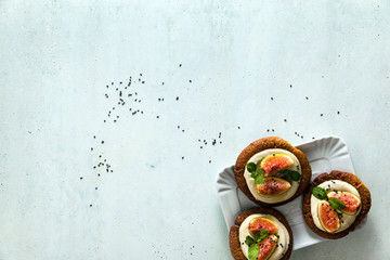 healthy gluten-free vegan cakes with sesame cookie base and cashew cream. with fresh figs. healthy cuisine