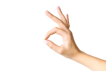 Beautiful female hand gesturing. Okay symbol. Isolated on white background.