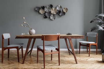 Modern dining room interior with glamour wooden table , stylish chairs and design decoration....