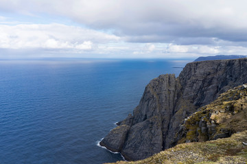 Majestic steep cliff view from the northcape, in northern Norway.