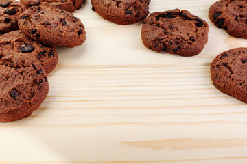 Tasty cookies with chocolate chips placed on a wooden background . Selective focus shot.