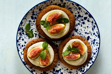healthy gluten-free vegan cakes with sesame cookie base and cashew cream. with fresh figs. healthy cuisine