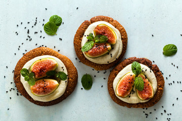healthy gluten-free vegan cakes with sesame cookie base and cashew cream. with fresh figs. healthy cuisine