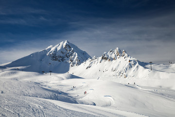 Fototapeta na wymiar Panoramic view of mountain ski area in French Alps