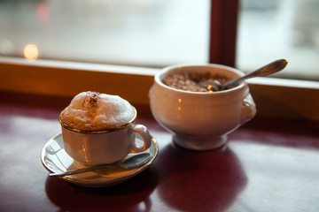 cappuccino with lush foam in the morning cafe
