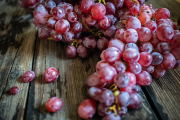 fresh organic red grape on old wooden vintage table