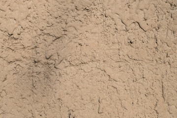Wall with a rough spray of cement-sand mortar