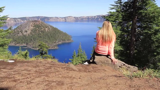 Woman enjoying the view at Crater Lake National Park in Oregon
