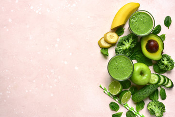Green vegetable detox smoothie with ingredients for making. Top view with copy space.