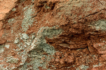 Close up of a soil with red clay in the quarry.