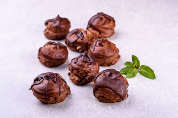  chocolate eclairs on a gray background in the kitchen10