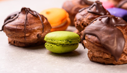 chocolate eclairs and macaroons for the restaurant menu