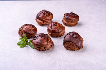  chocolate eclairs on a gray background in the kitchen6