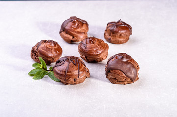  chocolate eclairs on a gray background in the kitchen5