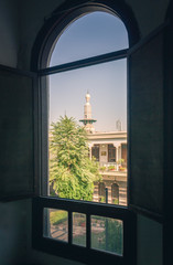 Through old house window over view of the ancient city of Damascus (Syrian Arab Republic)