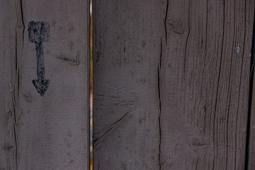 weathered wood with stencilled arrow