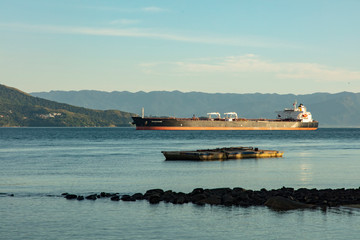Fototapeta na wymiar Oil tanker at the Petrobras maritime terminal of the sea near Ilhabela and Sao Sebastiao in Brazil