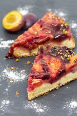 delicious desert plum tart slices on slate