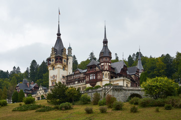 Peles Castle, residence of King Charles I in Sinaia, Romania. Autumn landscape of royal palace and...