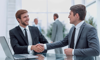close up. handshake of business people at the Desk