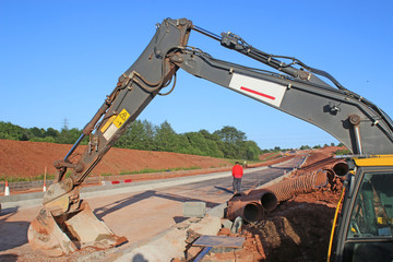 Digger on a road construction site